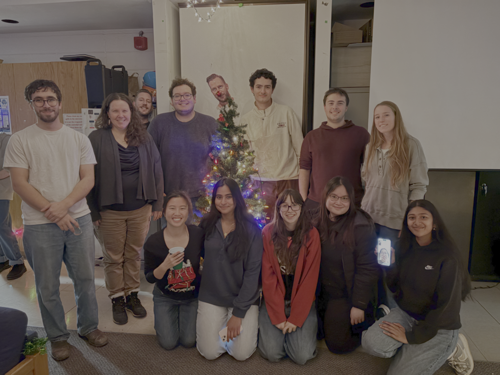 the WilsonToxLab, old and new, were all gathered around the Christmas tree.  Alex Little's photo tops the tree but he is also peeking over my shoulder in a live photobomb.  One of our students from last year, Emily, even joined the photo through video chat on a phone!